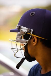 man wearing a cricket helmet